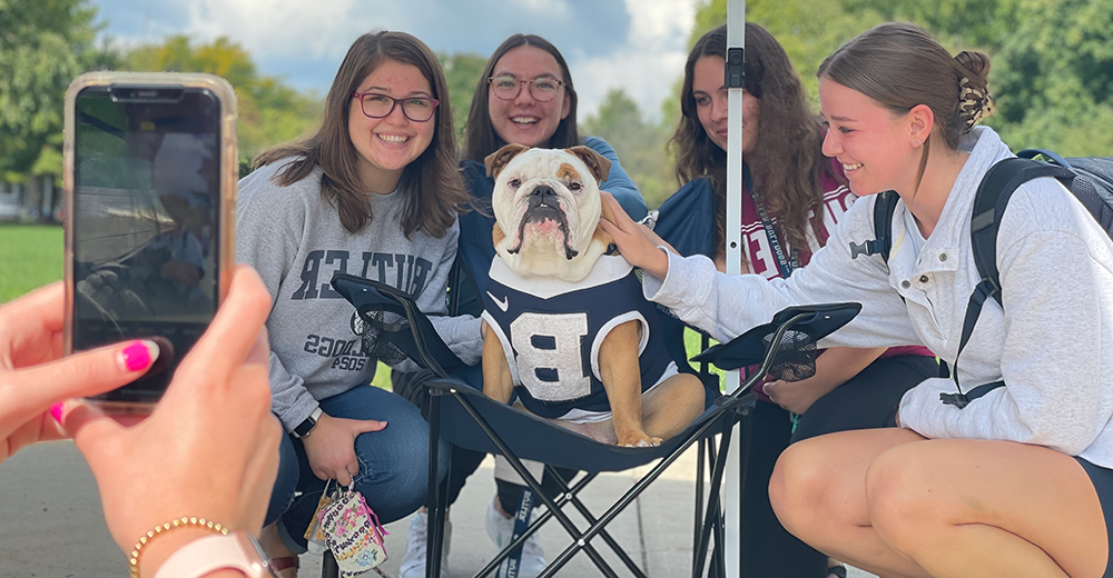 Butler Blue with students getting photographed